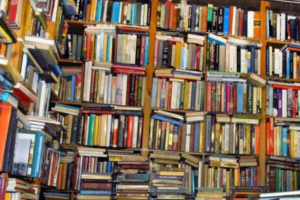 Shelves packed with free books at The Book Thing