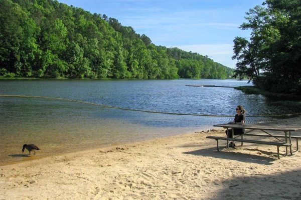 A campsite with a view of the lake at Oak Mountain State Park