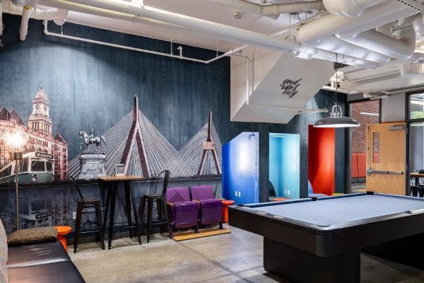 A clean, modern common area at the HI Boston Hostel