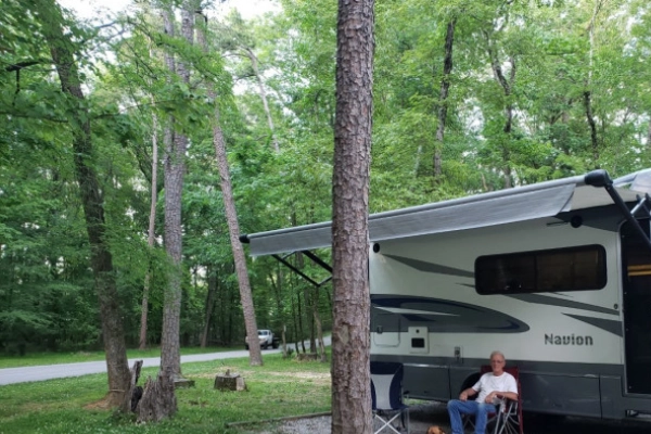 A campsite with a view of the lake at Harrison Bay State Park