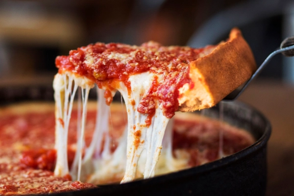 A slice of deep-dish pizza from Lou Malnati’s