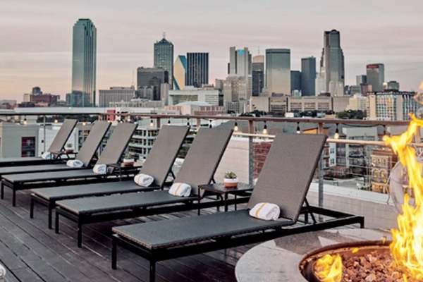 The rooftop pool with a skyline view at the Canvas Hotel