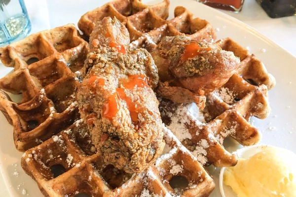 A plate of chicken and sweet potato waffles from Dame’s