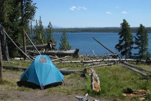 A campsite with a view of the lake at Blue Springs