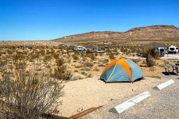 A campsite with a view of the red rocks