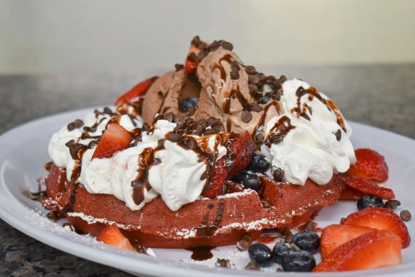 A stack of red velvet waffles from Johnny D’s Waffles