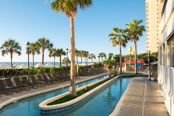 A luxurious, oceanfront room at The Breakers Resort