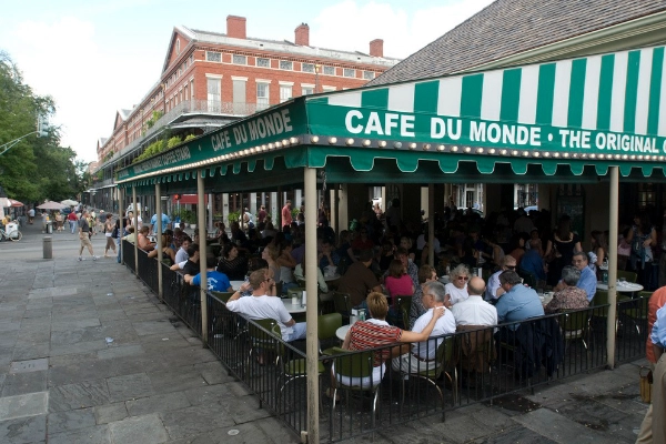 A plate of beignets covered in powdered sugar from Café du Monde
