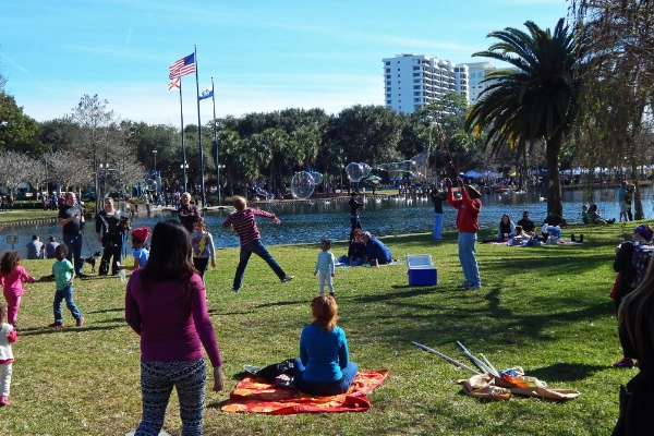 Swan boats on Lake Eola with fountain in background