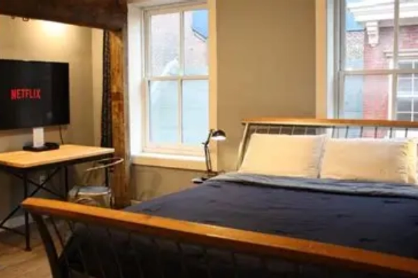 A clean, modern dorm room at Apple Hostels