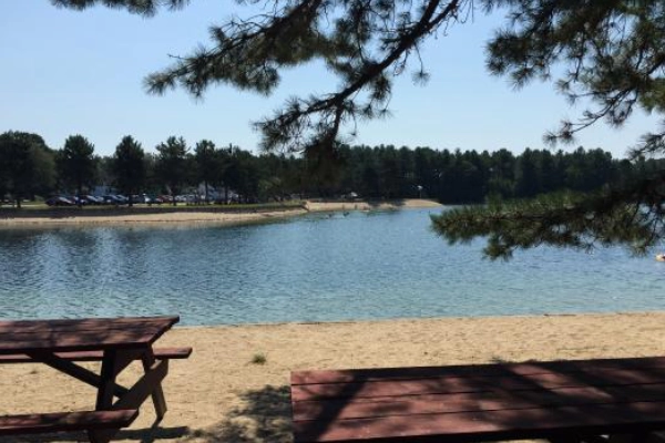 A campsite with a view of the lake at Wassamki Springs Campground