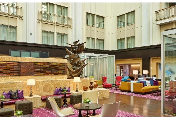 The modern, elegant lobby of The Nines hotel