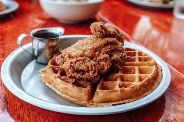 A plate of fried chicken and waffles from Beasley’s Chicken + Honey