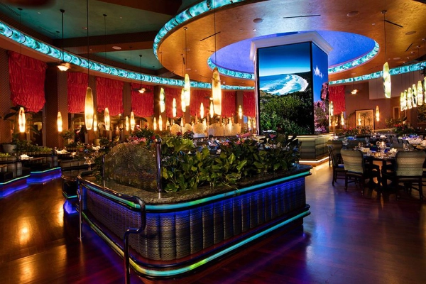 The opulent, neon-lit lobby of the Peppermill Resort Spa Casino