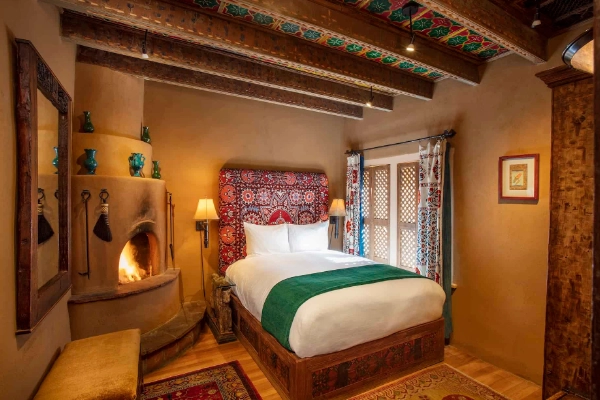 An eclectic, elegant adobe-style room at the Inn of the Five Graces
