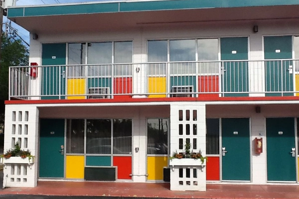 The retro, colorful exterior of the Thunderbird Inn