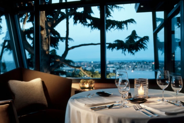 The elegant dining room at Canlis with a skyline view