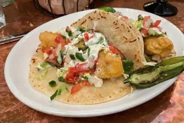A plate of corn tamales from Elote Cafe