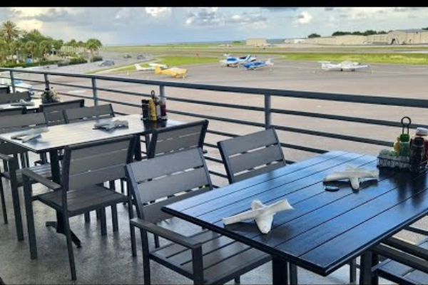 Shrimp tacos from The Hangar Restaurant with a view of the runway