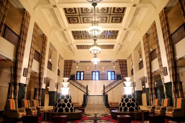 The elegant, historic Art Deco lobby of The Mayo Hotel
