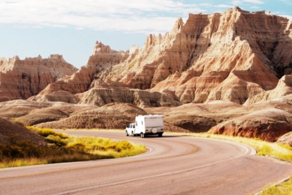 Colorful Lakota-inspired trail markers along the Badlands Loop Road