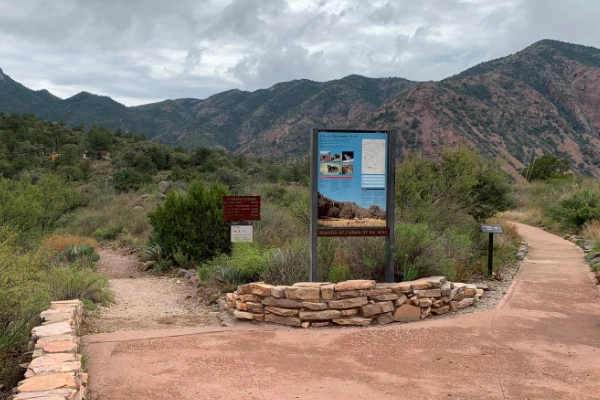 Colorful Comanche-inspired rock markers on a Chisos Basin trail