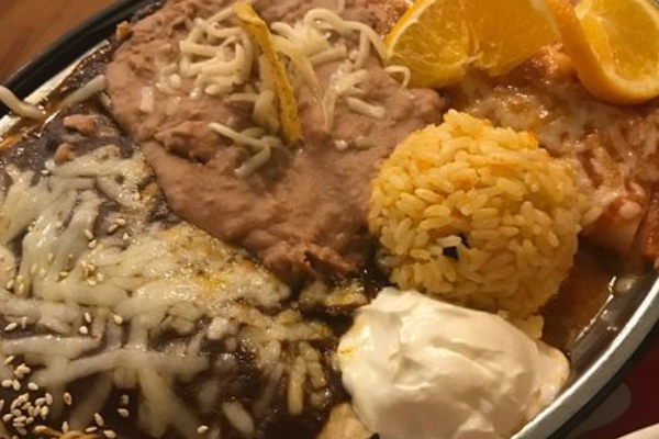 A plate of green chile enchiladas at Miguel’s Baja Grill