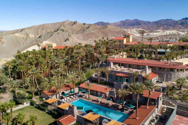 The lush palm trees and pool at The Oasis at Death Valley