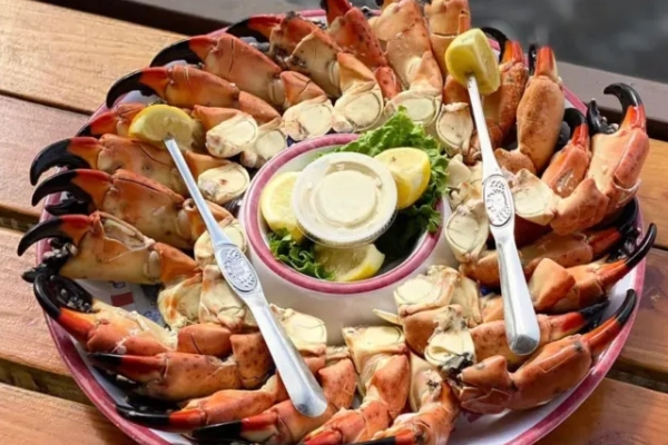 A fresh stone crab dinner enjoyed with a sunset view