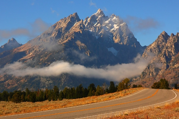A colorful Shoshone-inspired rock marker along Teton Park Road