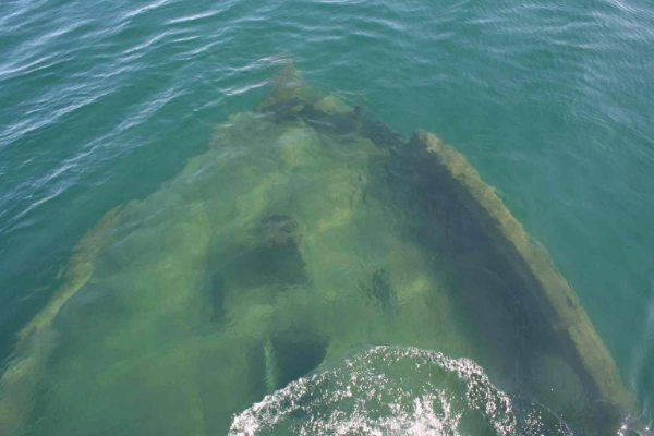A well-preserved shipwreck visible in the crystal-clear waters of Lake Superior