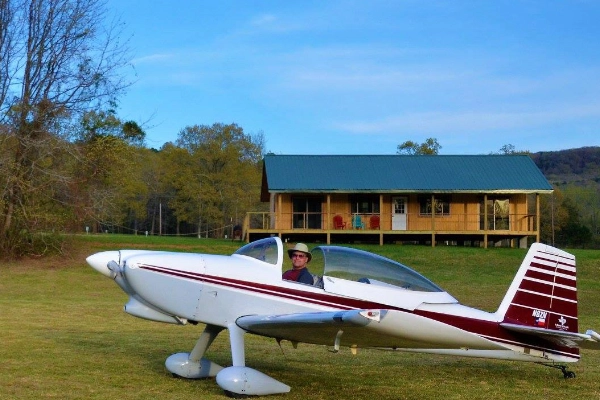 A quirky bush pilot lodge with a seaplane docked nearby