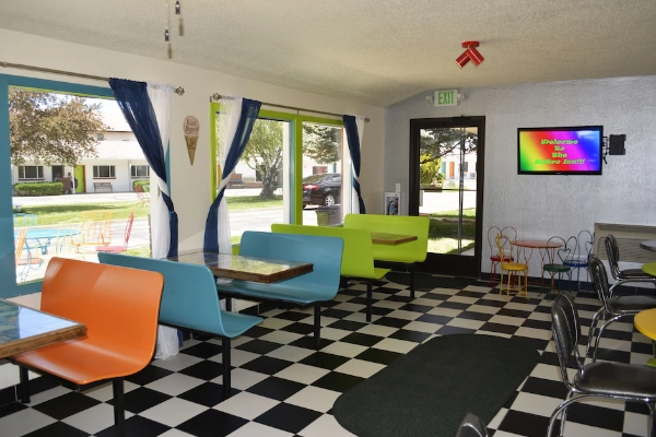A quirky motel with colorful doors and vintage, retro vibes