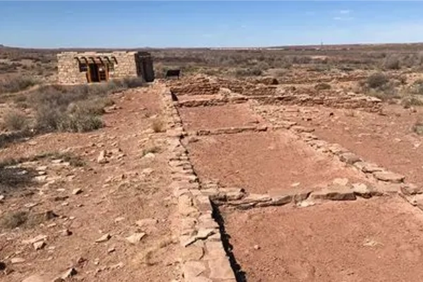 The ruins of an ancient 1300s settlement with nearby petroglyphs