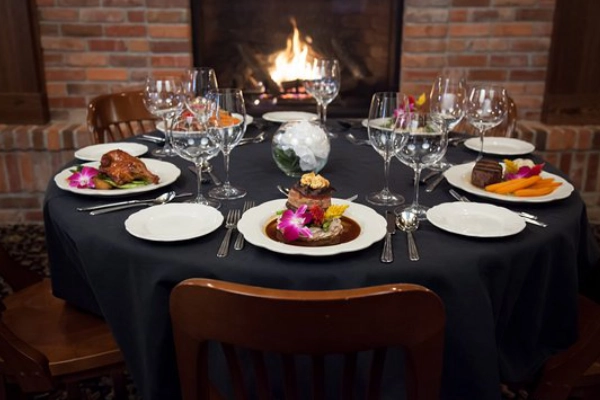 An elk burger served in a historic, elegant dining room