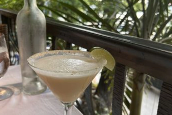 Jerk chicken and tropical cocktails at a vibrant island restaurant