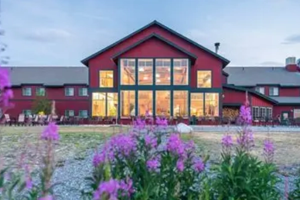 A luxurious wilderness lodge with stunning views of the surrounding mountains
