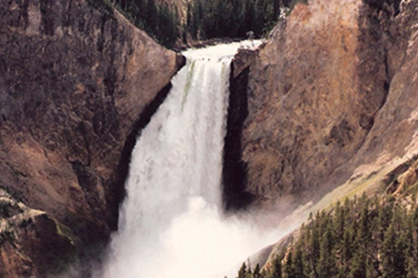 A panoramic view of the Grand Canyon of the Yellowstone with a large waterfall